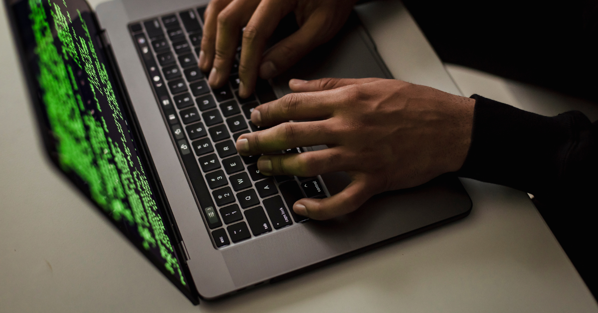 a person typing on a laptop